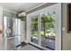Kitchen featuring stainless steel appliances, white cabinetry, and sliding glass doors to the patio at 3123 Brassfield Rd, Creedmoor, NC 27522