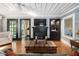 Cozy living room with a fireplace, built-in shelving, and hardwood floors at 3123 Brassfield Rd, Creedmoor, NC 27522