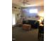Comfortable living room features neutral carpet, a ceiling fan and good natural lighting at 3123 Brassfield Rd, Creedmoor, NC 27522