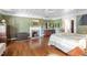 Serene main bedroom with a fireplace, dresser, hardwood floors, and tranquil ambiance at 3123 Brassfield Rd, Creedmoor, NC 27522
