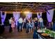 Lively patio adorned with string lights where guests dance and celebrate, creating a festive atmosphere at 3123 Brassfield Rd, Creedmoor, NC 27522