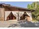 Rustic Tavern view of outdoor seating area with draping, offering a relaxing and scenic experience at 3123 Brassfield Rd, Creedmoor, NC 27522