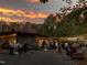 Picturesque venue with rustic building and outdoor event space under a beautiful sunset at 3123 Brassfield Rd, Creedmoor, NC 27522