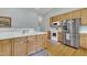 Spacious kitchen area featuring wooden cabinets, stainless steel appliances, and a sink with countertop space at 316 Waterford Dr, Clayton, NC 27520