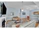 Open-concept living room with hardwood floors, a fireplace, and easy access to the kitchen at 316 Waterford Dr, Clayton, NC 27520