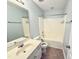 Well-lit bathroom with a tub-shower, vanity sink, and light-colored walls at 358 Red Elm Dr, Durham, NC 27713