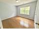 Simple bedroom with hardwood floors, one window letting in lots of natural light at 358 Red Elm Dr, Durham, NC 27713