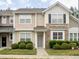 Charming townhome featuring stone accents, neutral siding, and inviting front entrance at 358 Red Elm Dr, Durham, NC 27713