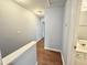 A hallway leading to an adjacent bathroom and other bedrooms at 358 Red Elm Dr, Durham, NC 27713