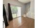 Bright kitchen featuring a sliding glass door leading to the backyard, hardwood floors, and staircase at 358 Red Elm Dr, Durham, NC 27713
