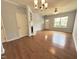 Bright living area featuring hardwood floors, ample light, and a classic fireplace at 358 Red Elm Dr, Durham, NC 27713