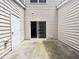 Private patio with sliding glass door access, offering an outdoor living space at 358 Red Elm Dr, Durham, NC 27713
