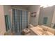 Bathroom featuring a floral shower curtain and neutral accents at 400 Southerby Dr, Garner, NC 27529