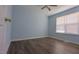 A large bedroom with hardwood floors and a large window at 400 Southerby Dr, Garner, NC 27529