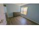 Cozy bedroom with a window view and modern flooring at 400 Southerby Dr, Garner, NC 27529