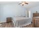 Bedroom featuring a vaulted ceiling, wood-look flooring, and a large bed with matching furniture at 400 Southerby Dr, Garner, NC 27529