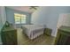 Calming bedroom with neutral walls, hardwood flooring, and ample natural light at 400 Southerby Dr, Garner, NC 27529