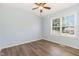 Bedroom featuring a ceiling fan, wood-look flooring, and a bright window at 400 Southerby Dr, Garner, NC 27529