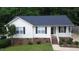 Charming single story home with bright siding, neat landscaping, and a welcoming front porch at 400 Southerby Dr, Garner, NC 27529