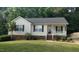 Charming single-story home with bright siding, neat landscaping, and a welcoming front porch at 400 Southerby Dr, Garner, NC 27529