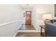 Inviting foyer with hardwood floors, leading to a stylish wooden front door and a glimpse of the outdoors at 400 Southerby Dr, Garner, NC 27529