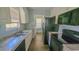 Efficient kitchen with stainless appliances, light cabinetry, and sleek countertops at 400 Southerby Dr, Garner, NC 27529