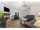 Inviting living room with a fireplace, vaulted ceilings, hardwood floors, and comfortable seating area at 400 Southerby Dr, Garner, NC 27529