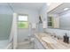 Updated bathroom features a granite countertop and tiled shower at 4017 Huckleberry Dr, Raleigh, NC 27612