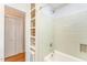 Updated bathroom features shower and convenient shelving for storage at 4017 Huckleberry Dr, Raleigh, NC 27612