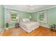 Comfortable bedroom with hardwood floors and bright natural light at 4017 Huckleberry Dr, Raleigh, NC 27612