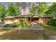 Charming brick ranch style home featuring manicured landscaping and attached garage at 4017 Huckleberry Dr, Raleigh, NC 27612