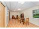This game room features wood flooring, a glass top table, and two chairs at 4017 Huckleberry Dr, Raleigh, NC 27612