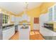 Bright kitchen with white cabinets, granite countertops and stainless appliances at 4017 Huckleberry Dr, Raleigh, NC 27612