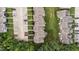 Aerial view of townhomes showcasing the community layout and landscaping at 407 Whitehall Ct, Clayton, NC 27520