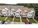 Overhead shot of townhomes with manicured lawns, landscaping, and convenient parking at 407 Whitehall Ct, Clayton, NC 27520