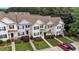 Overhead shot of townhomes with manicured lawns, landscaping, and convenient parking at 407 Whitehall Ct, Clayton, NC 27520
