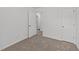 A bedroom with neutral carpet and white walls at 407 Whitehall Ct, Clayton, NC 27520