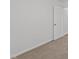 A cozy bedroom featuring neutral walls, carpet, and a white door at 407 Whitehall Ct, Clayton, NC 27520
