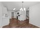 Contemporary kitchen featuring stainless steel appliances, white cabinets, and sleek countertops at 407 Whitehall Ct, Clayton, NC 27520