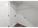 Functional laundry room with shelving and ample space at 407 Whitehall Ct, Clayton, NC 27520