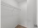 This is an empty walk-in closet featuring neutral carpet, white walls, and a wire shelf at 407 Whitehall Ct, Clayton, NC 27520