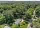 Aerial view showcasing lush forest surrounding this single-Gathering home on large manicured lot at 4112 Huckleberry Dr, Raleigh, NC 27612