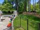 Spacious, fenced backyard with a patio and outdoor fireplace feature at 4112 Huckleberry Dr, Raleigh, NC 27612