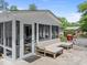 View of backyard screened-in porch, patio, and a grill set at 4112 Huckleberry Dr, Raleigh, NC 27612