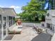 View of backyard patio area, fireplace, grill and outdoor furniture set at 4112 Huckleberry Dr, Raleigh, NC 27612