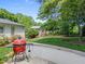 Fenced-in backyard with an outdoor grill and a green lawn at 4112 Huckleberry Dr, Raleigh, NC 27612