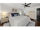 Comfortable bedroom featuring a ceiling fan, wood floors and plantation shutters at 4112 Huckleberry Dr, Raleigh, NC 27612
