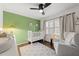 Cozy Bedroom with modern furniture, ceiling fan, and plantation shutters at 4112 Huckleberry Dr, Raleigh, NC 27612