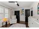 View of the charming Bedroom with a comfortable glider and book display at 4112 Huckleberry Dr, Raleigh, NC 27612