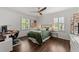 Well-lit bedroom featuring a desk and comfortable bed with hardwood flooring at 4112 Huckleberry Dr, Raleigh, NC 27612